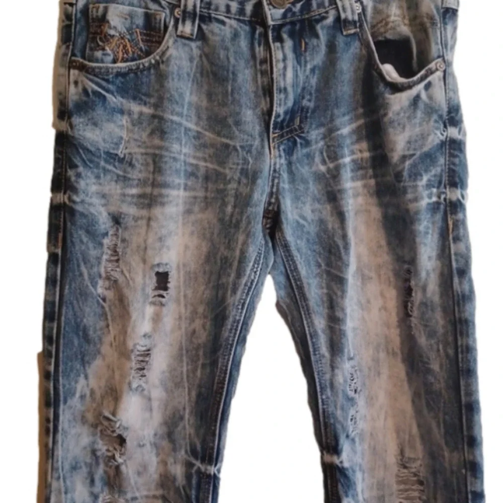 Black brand super distressed, acid wash looking jeans.Size 30x32.